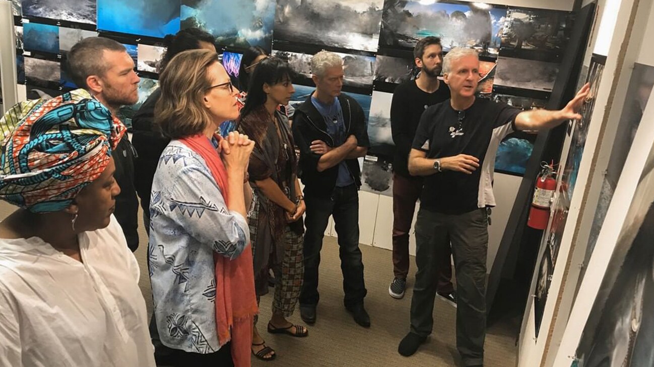 James Cameron and cast in Avatar art room